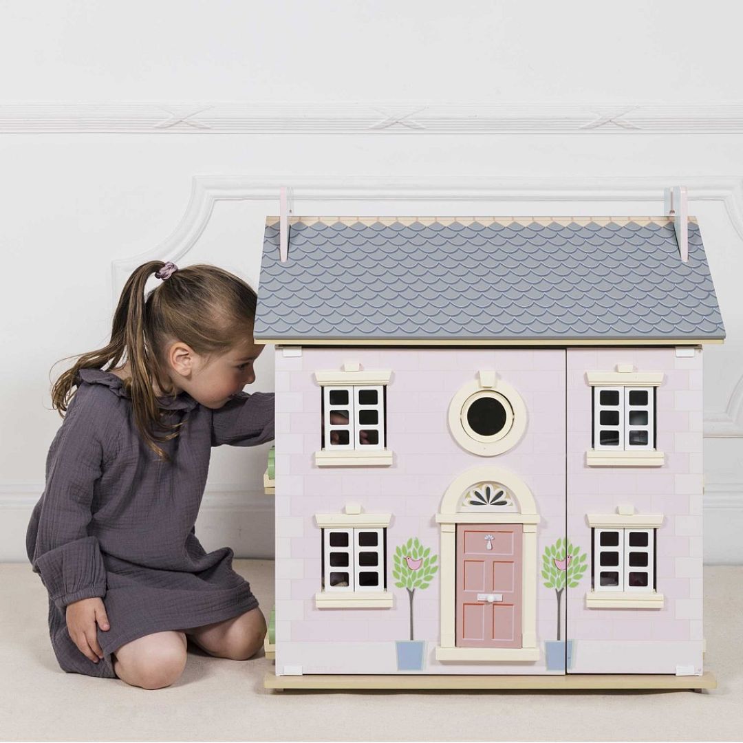 H107-girl-playing-through-window-of-thebay-tree-dolls-house.jpg